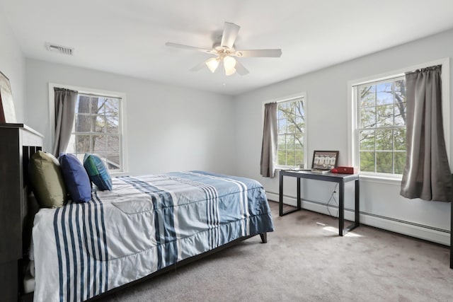 27 Lindbergh Ln, New City, NY 10956 - carpeted bedroom with baseboard heating, a ceiling fan, and visible vents