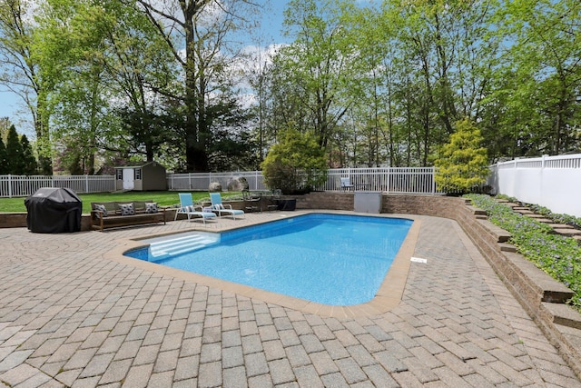 27 Lindbergh Ln, New City, NY 10956 - view of pool with a patio, a fenced backyard, an outbuilding, and a storage shed