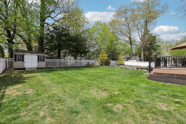 27 Lindbergh Ln, New City, NY 10956 - view of yard with a deck, an outbuilding, a fenced backyard, and a storage unit