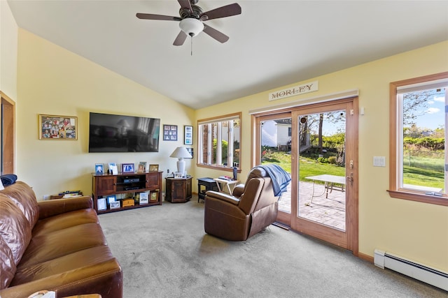 living area featuring carpet, ceiling fan, baseboard heating, and a healthy amount of sunlight