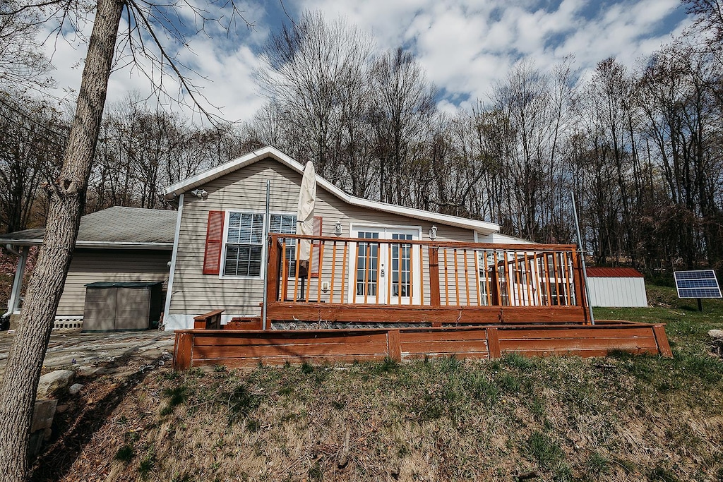 24 Sky Top Rd, Bloomingburg, NY 12721 - back of property with a deck and french doors