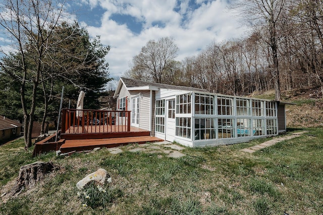 view of outdoor structure featuring a sunroom