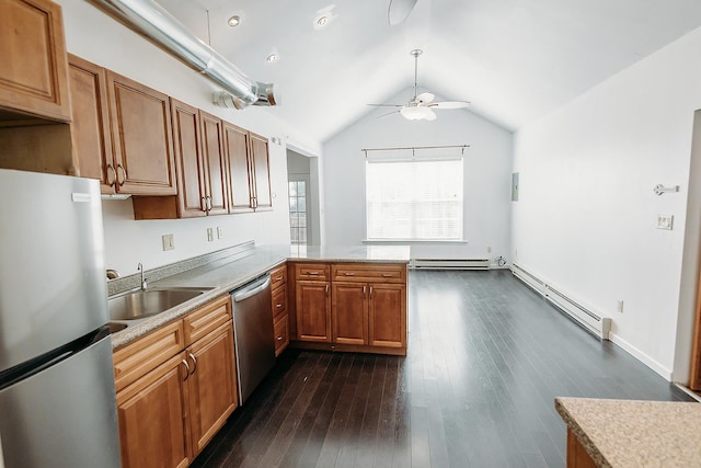 kitchen featuring appliances with stainless steel finishes, a baseboard radiator, a ceiling fan, and a sink