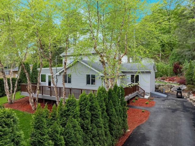 view of front of house with a wooden deck