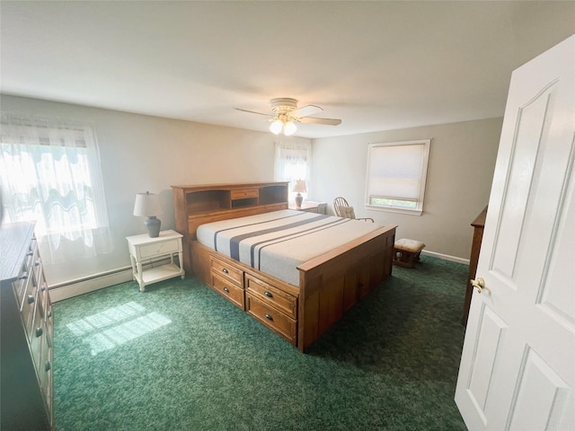 19 Millbrook Dr, Stony Brook, NY 11790 - bedroom with dark carpet, baseboards, ceiling fan, and a baseboard heating unit