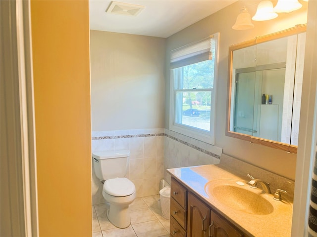 19 Millbrook Dr, Stony Brook, NY 11790 - full bath featuring visible vents, tile walls, tile patterned flooring, vanity, and toilet