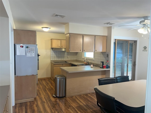 19 Millbrook Dr, Stony Brook, NY 11790 - kitchen with dark wood-type flooring, decorative backsplash, a peninsula, and visible vents