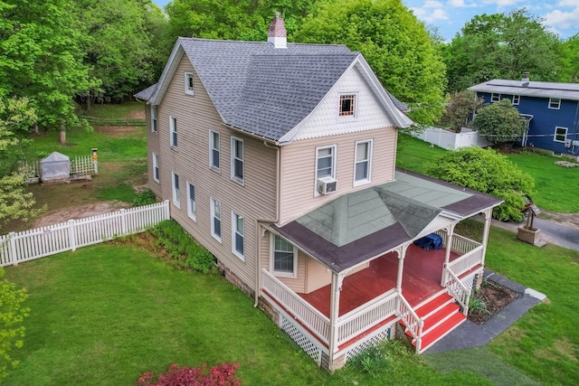 31 Highland Ave, Otisville, NY 10963 - back of house with roof with shingles, covered porch, a chimney, and cooling unit