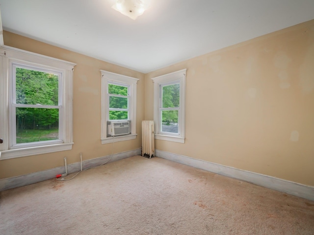 31 Highland Ave, Otisville, NY 10963 - carpeted empty room featuring radiator heating unit, cooling unit, and baseboards