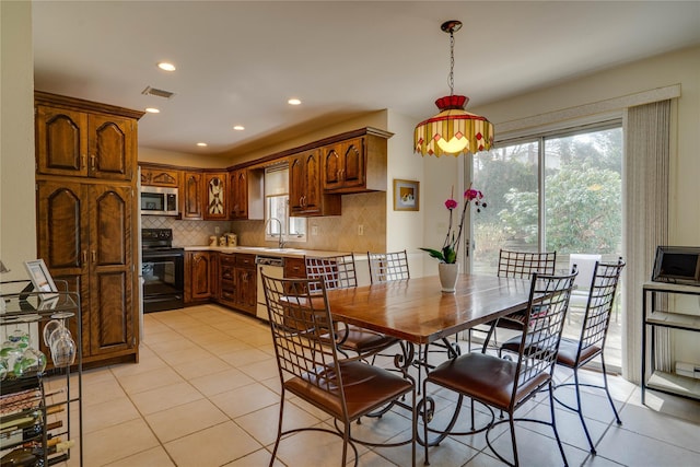 dining space featuring recessed lighting, visible vents, plenty of natural light, and light tile patterned floors