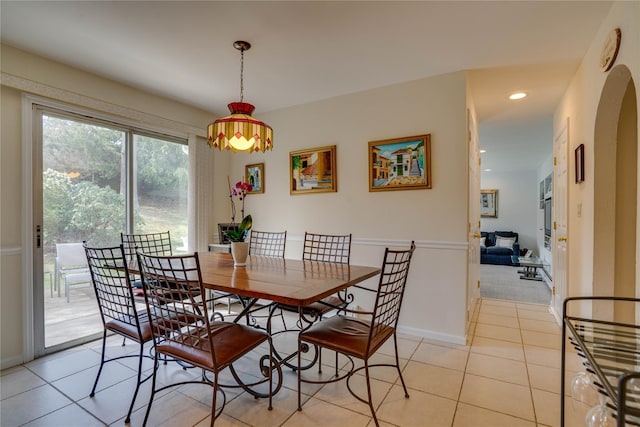 dining room with recessed lighting, baseboards, and light tile patterned flooring