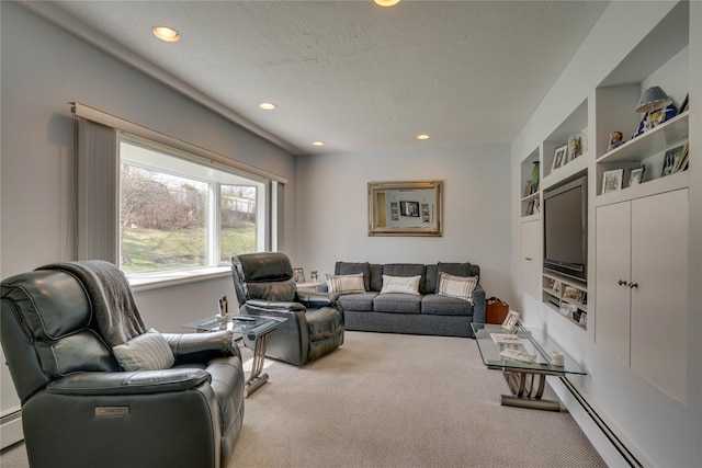 living room with a textured ceiling, built in shelves, a baseboard heating unit, light carpet, and recessed lighting
