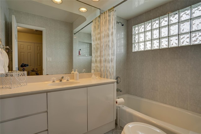 bathroom featuring vanity and shower / bath combo with shower curtain