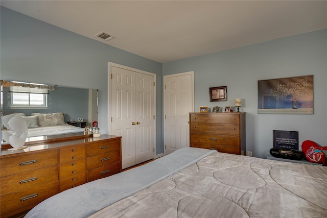 bedroom featuring a closet and visible vents