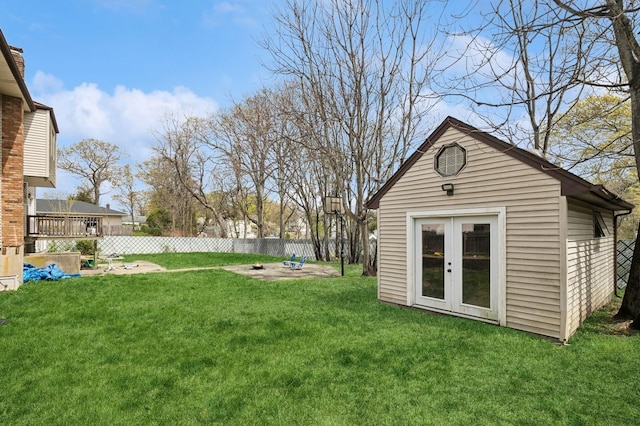 view of yard with an outdoor structure and fence