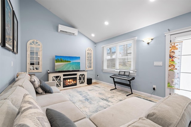 living room featuring a wall mounted AC, baseboards, high vaulted ceiling, a glass covered fireplace, and recessed lighting