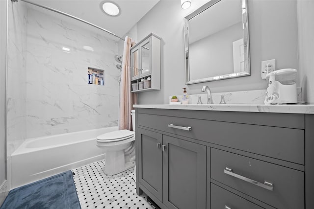 bathroom with vanity, shower / tub combo with curtain, and toilet