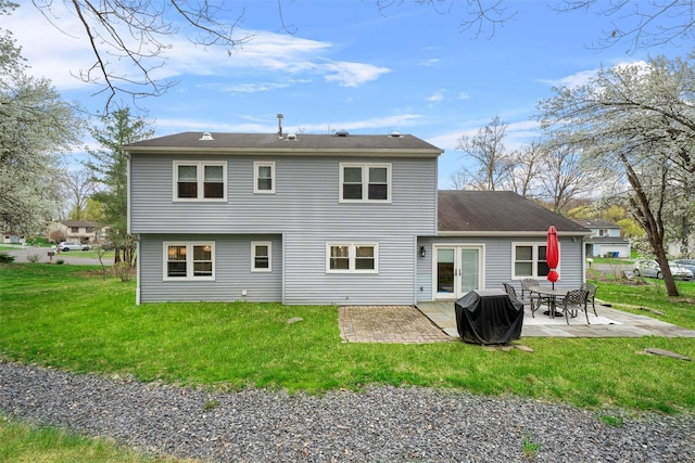 rear view of property with a patio area and a yard