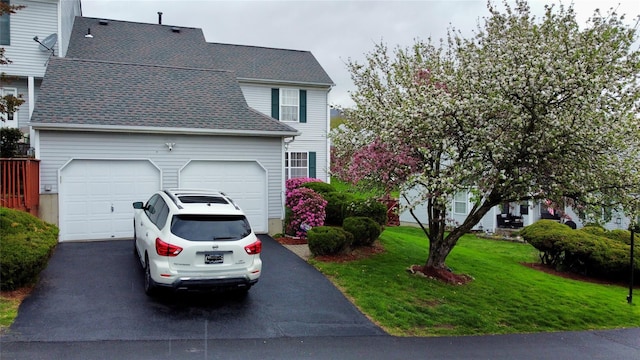5 Fox Meadow Dr, Woodbury, NY 10930 - view of front facade featuring a front yard, roof with shingles, aphalt driveway, and an attached garage