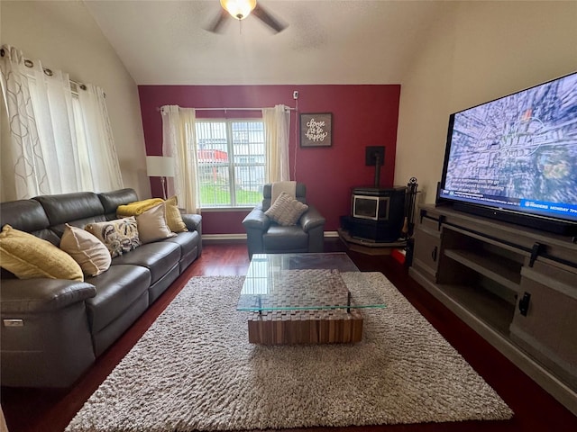 5 Fox Meadow Dr, Woodbury, NY 10930 - living area with a ceiling fan, dark wood-type flooring, baseboards, a wood stove, and vaulted ceiling
