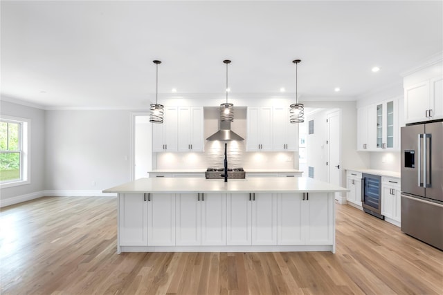 33 Lagoon Ct, Jamesport, NY 11901 - kitchen featuring high end fridge, beverage cooler, light countertops, wall chimney exhaust hood, and ornamental molding