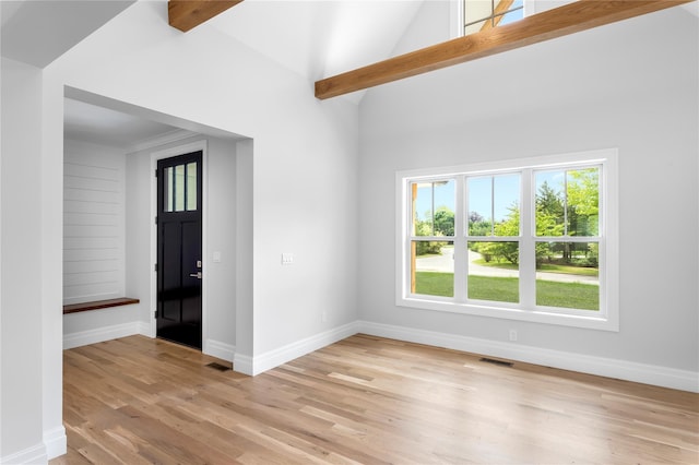 33 Lagoon Ct, Jamesport, NY 11901 - unfurnished room featuring light wood finished floors, baseboards, and high vaulted ceiling