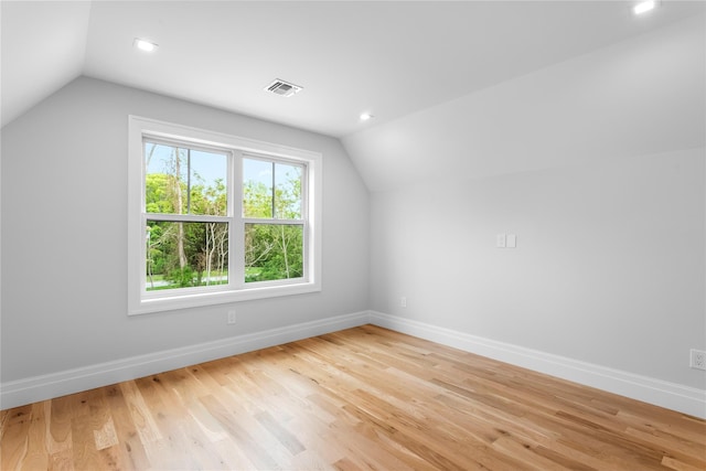 33 Lagoon Ct, Jamesport, NY 11901 - additional living space with vaulted ceiling, baseboards, light wood-style floors, and recessed lighting