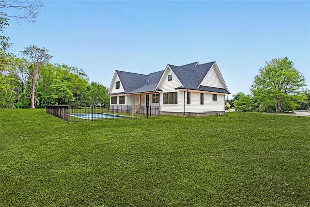 33 Lagoon Ct, Jamesport, NY 11901 - rear view of house featuring a shingled roof
