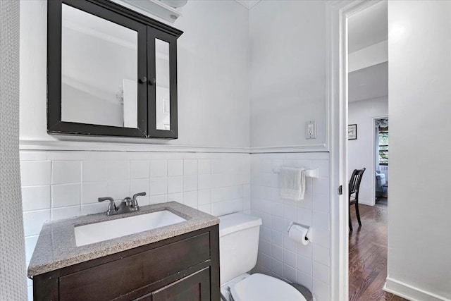19 Rockledge Rd Unit 1A, Hartsdale, NY 10530 - half bath featuring tile walls, toilet, vanity, and wood finished floors
