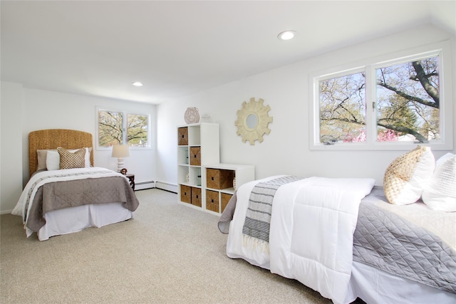 bedroom with recessed lighting, a baseboard heating unit, and carpet floors