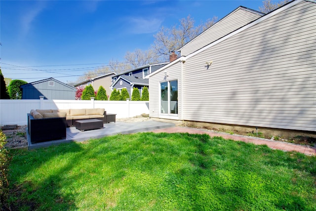view of yard featuring a patio area, outdoor lounge area, and a fenced backyard