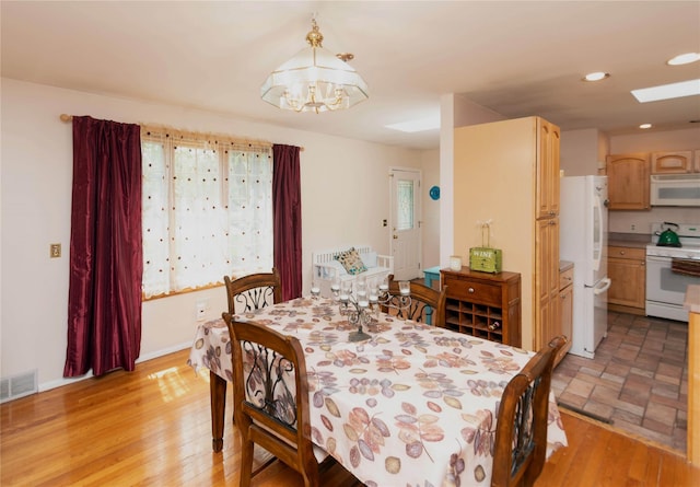 130 E Main St, Washingtonville, NY 10992 - dining area with visible vents, recessed lighting, light wood-style floors, and an inviting chandelier
