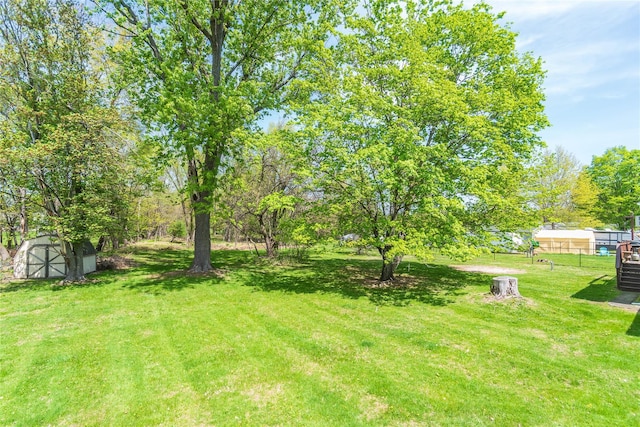 130 E Main St, Washingtonville, NY 10992 - view of yard featuring fence, a storage unit, and an outbuilding