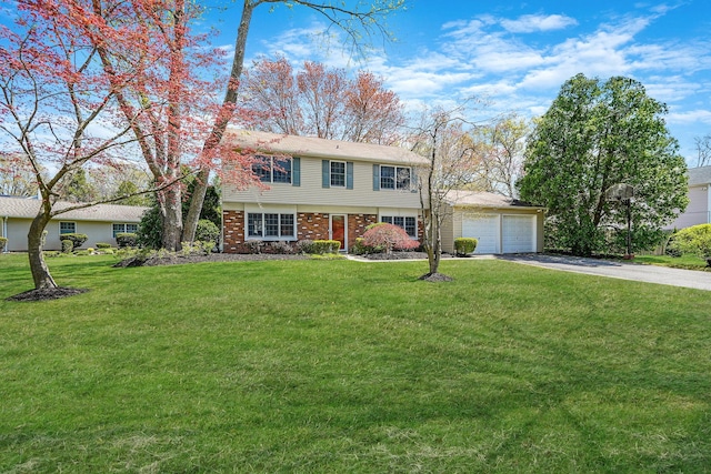 18 Botany Ln, Stony Brook, NY 11790 - view of front of house featuring a garage, a front yard, brick siding, and aphalt driveway
