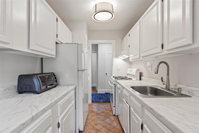 kitchen featuring a sink, a toaster, white cabinets, under cabinet range hood, and white appliances