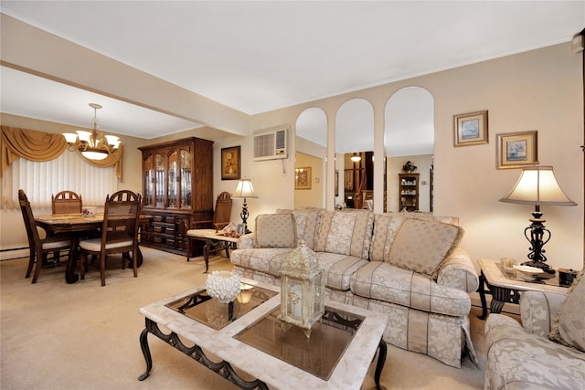 living area with light colored carpet, a wall mounted AC, and an inviting chandelier