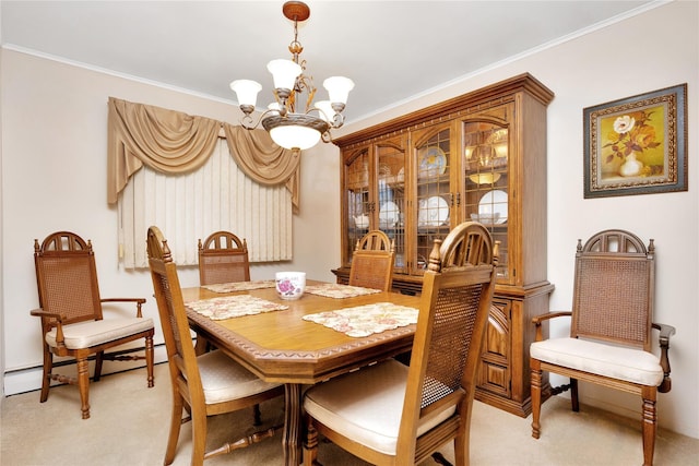 dining space with ornamental molding, a baseboard heating unit, a chandelier, and light carpet