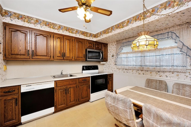 kitchen with a sink, range with electric cooktop, a wainscoted wall, stainless steel microwave, and dishwashing machine
