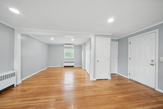 83 Woodcock Mtn Rd, Washingtonville, NY 10992 - interior space with light wood-type flooring, baseboards, radiator heating unit, and crown molding