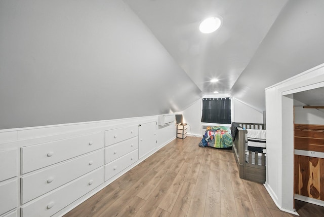 83 Woodcock Mtn Rd, Washingtonville, NY 10992 - additional living space featuring baseboards, an AC wall unit, wood finished floors, and vaulted ceiling