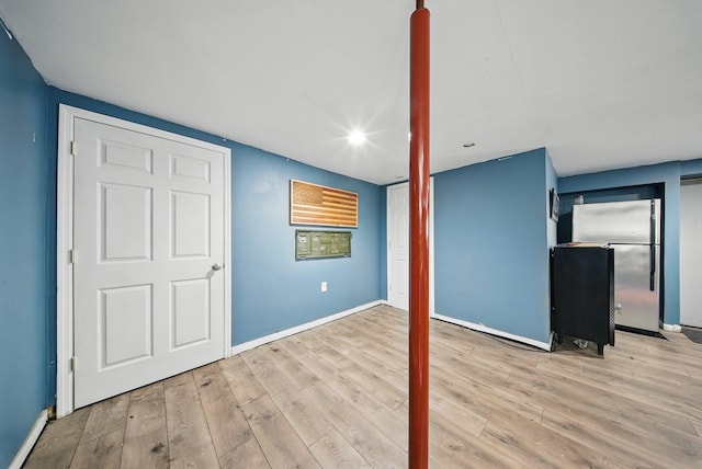 83 Woodcock Mtn Rd, Washingtonville, NY 10992 - interior space featuring freestanding refrigerator, baseboards, and wood finished floors