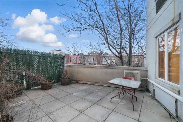 view of patio / terrace featuring fence
