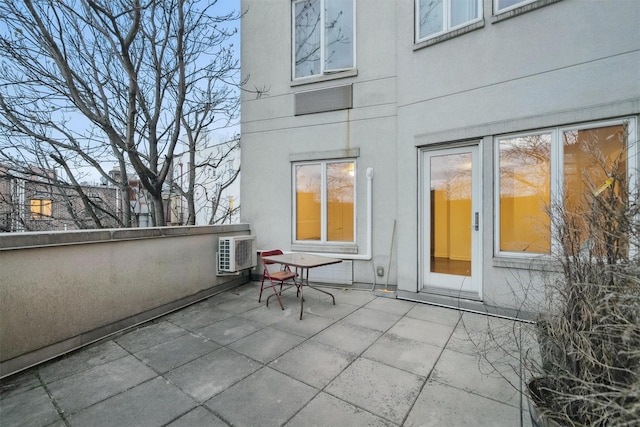 back of house featuring a patio and stucco siding