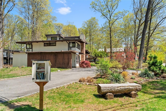 exterior space with aphalt driveway