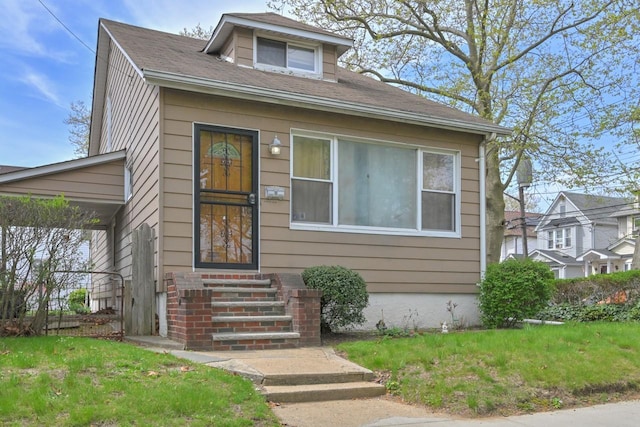 bungalow-style home featuring entry steps