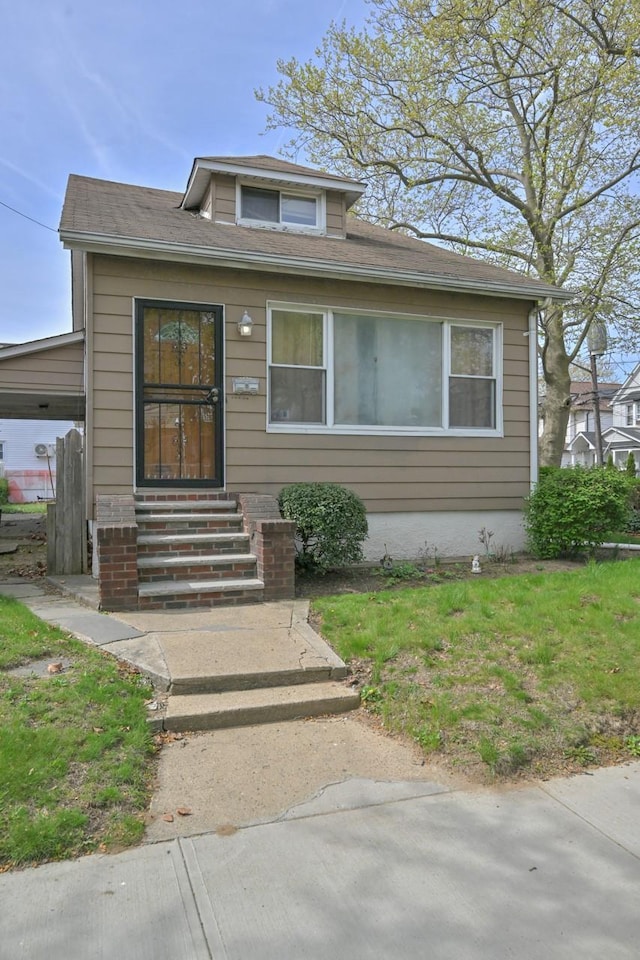 bungalow-style house featuring entry steps
