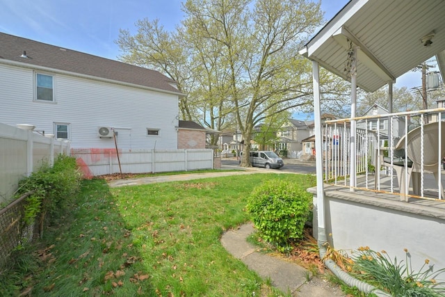 view of yard featuring fence and a residential view