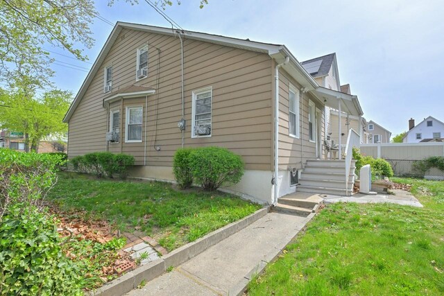 114-02 Sutter Ave, South Ozone Park, NY 11420 - view of side of property with fence and a yard
