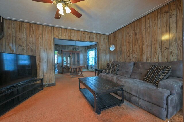 114-02 Sutter Ave, South Ozone Park, NY 11420 - carpeted living room with wooden walls and a ceiling fan