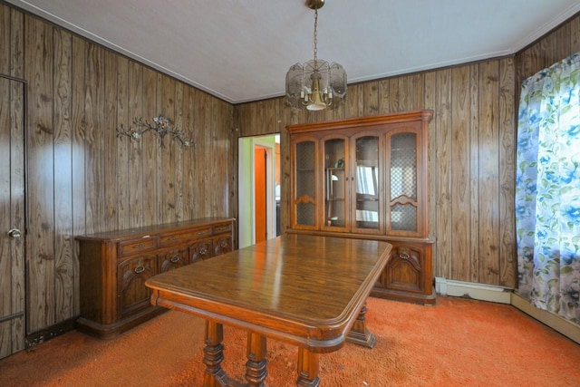 dining room with wooden walls, carpet floors, and a notable chandelier
